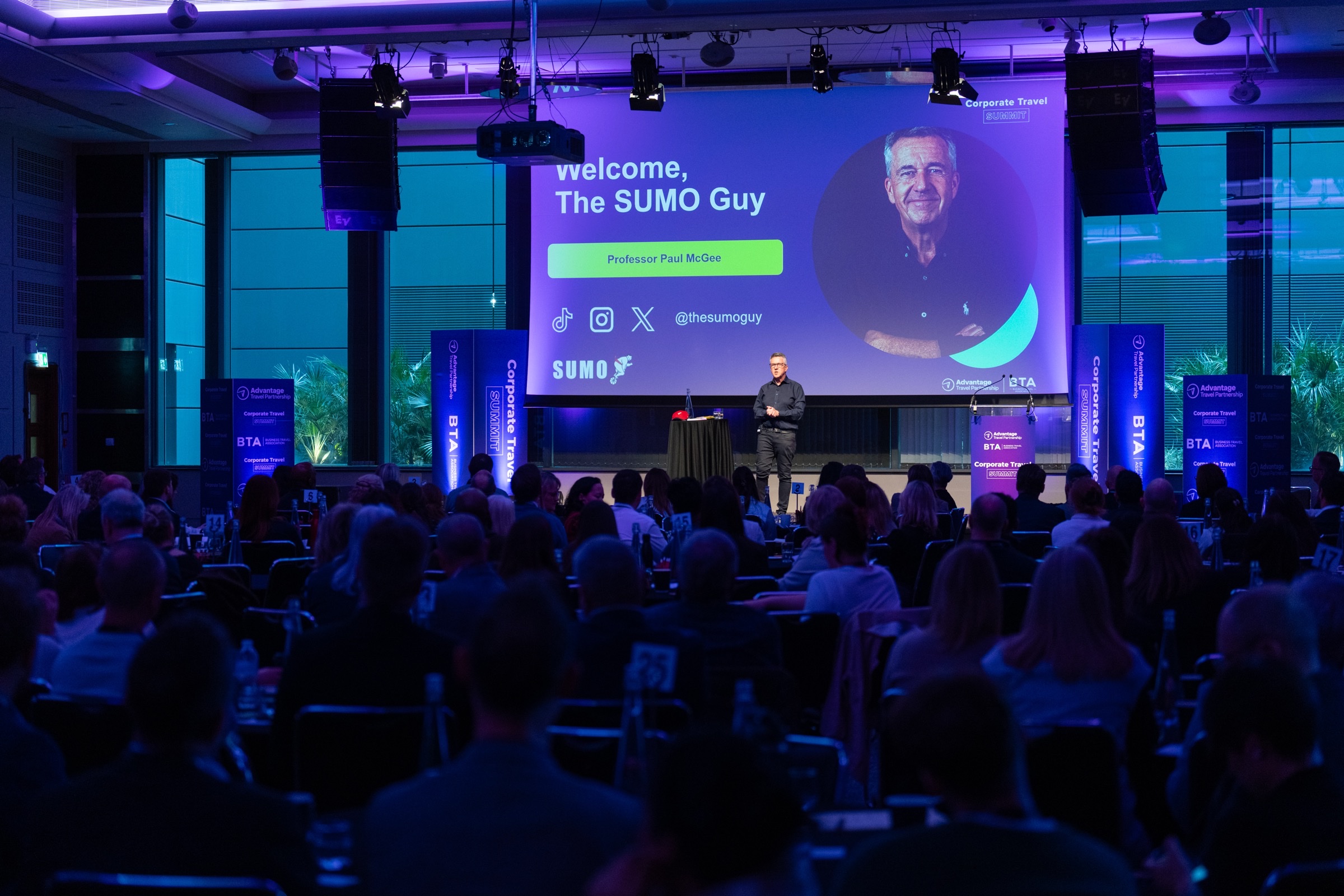 Paul McGee presenting to a large audience